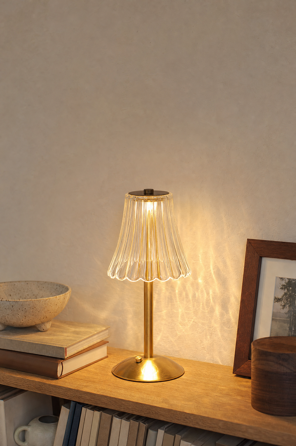 Crystal-cut tulip lamp glowing on an oak shelf