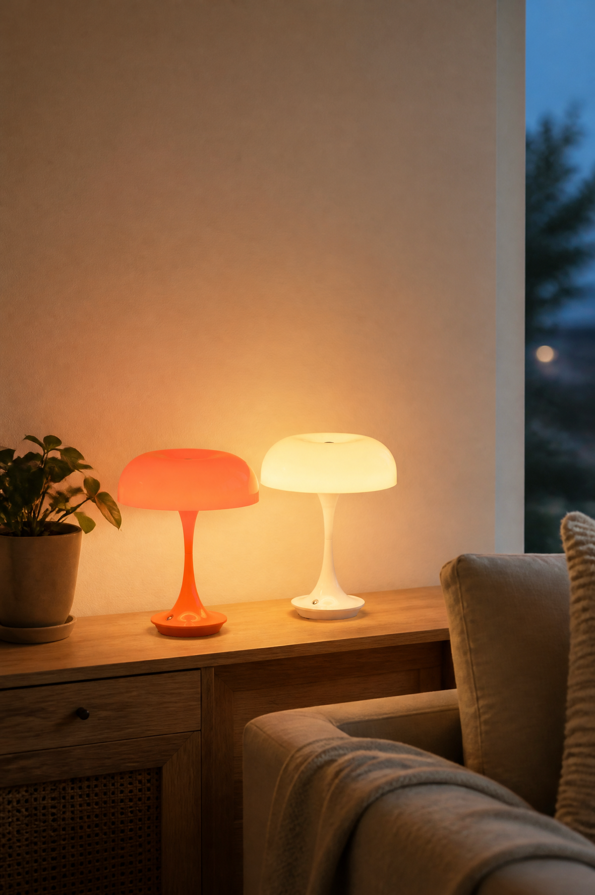 Orange and white mushroom lamps glowing on a sideboard