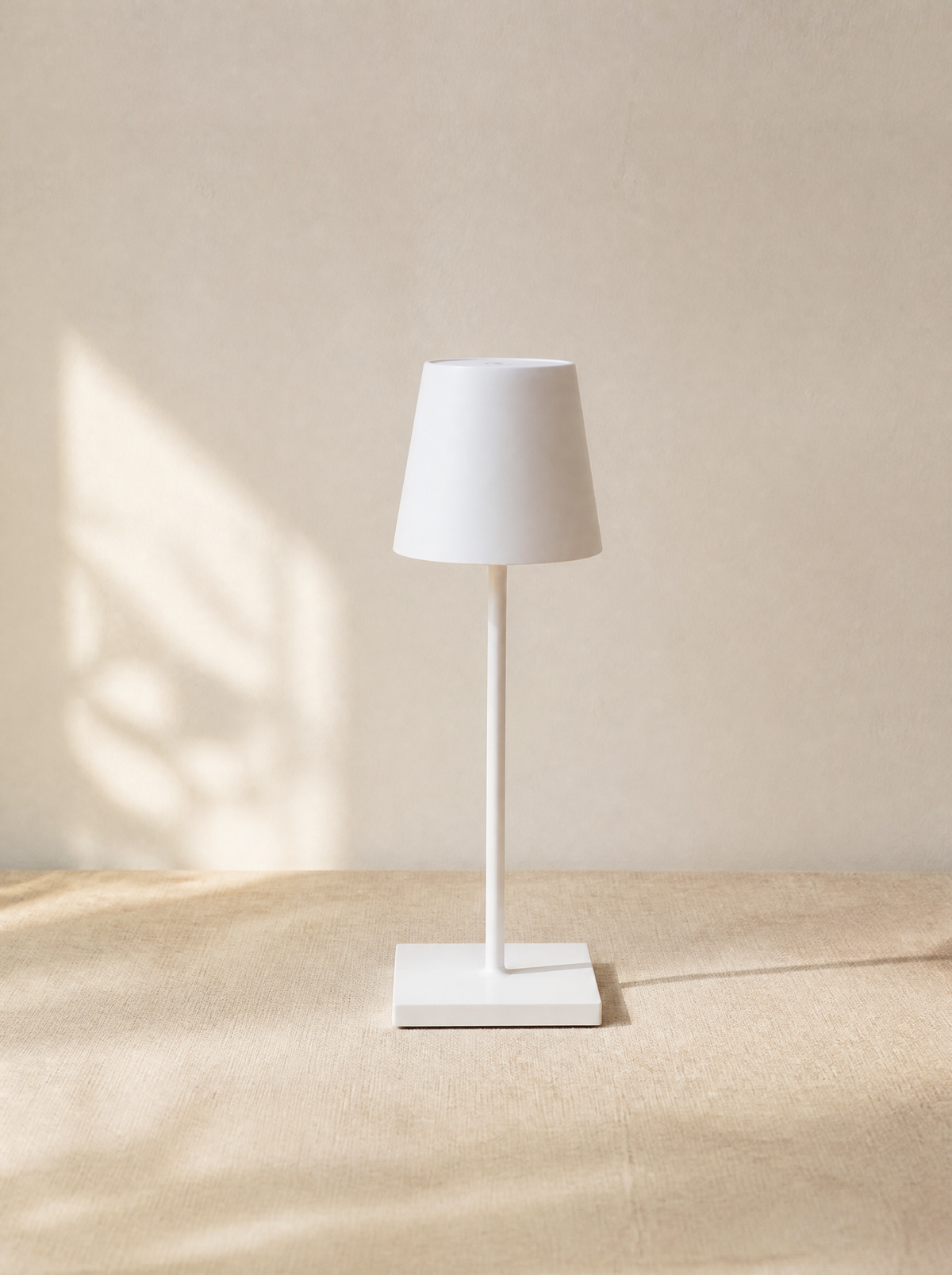 White cordless bistro table lamp in daylight