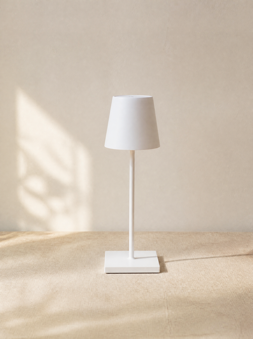 White cordless bistro table lamp in daylight