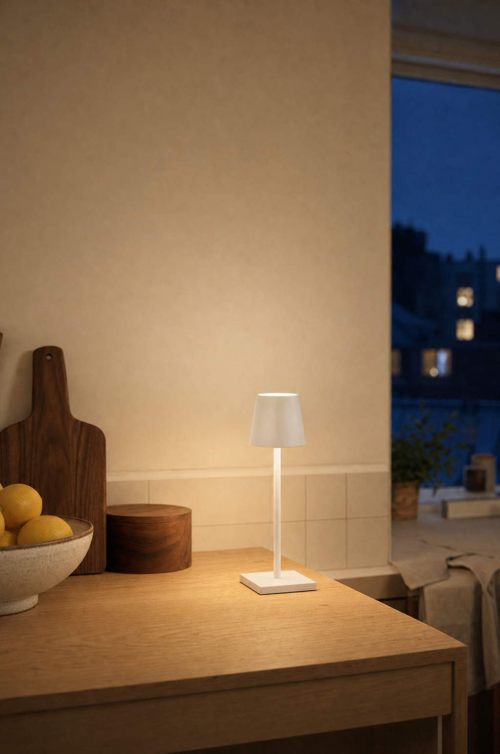 Cordless bistro table lamp on a kitchen counter at night