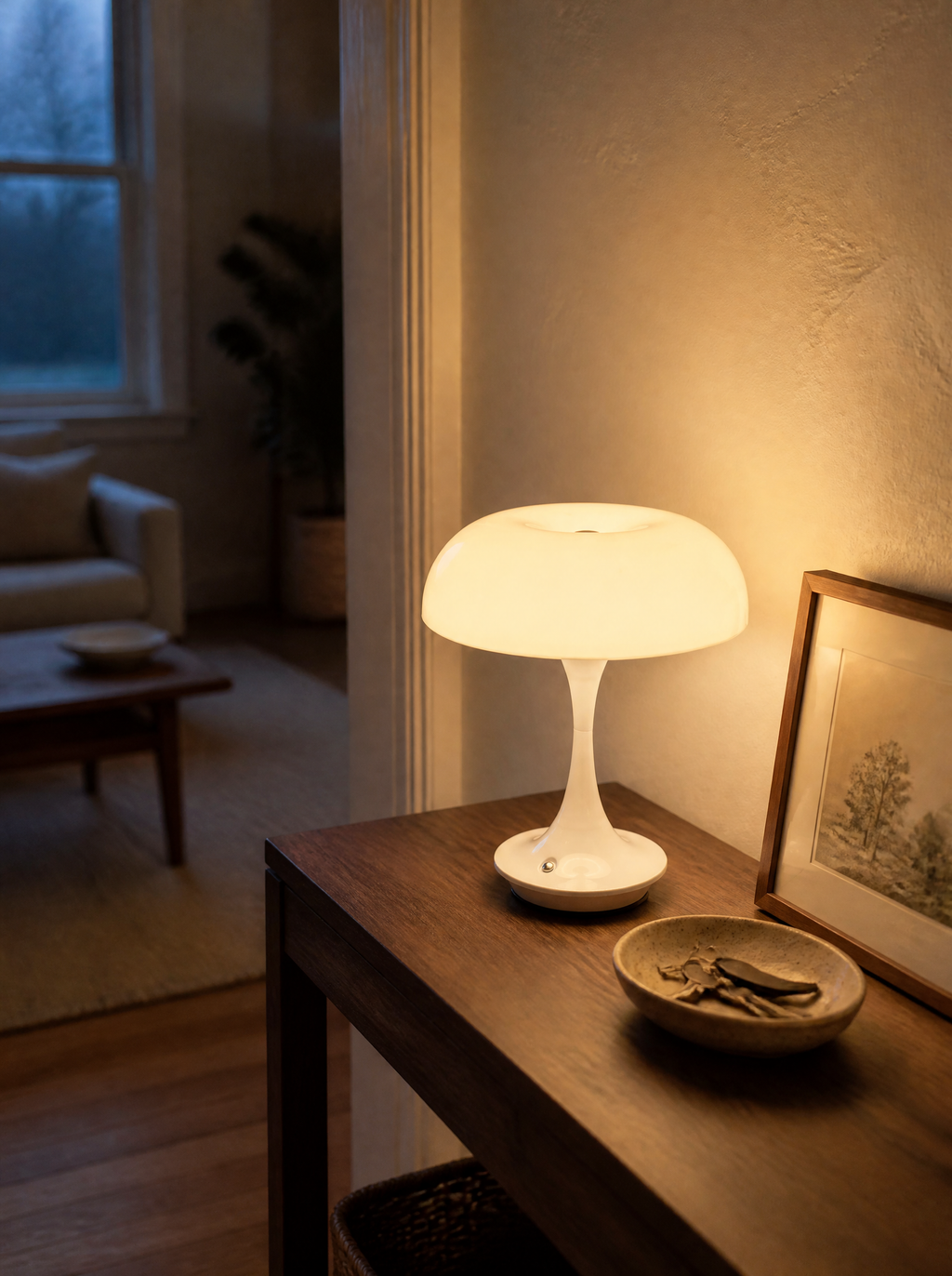 White mushroom lamp glowing on an entryway console