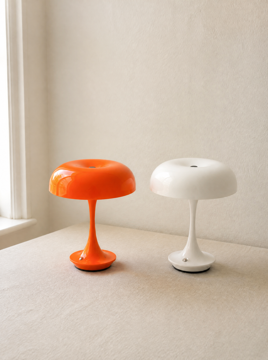 Orange and white cordless mushroom lamps in daylight